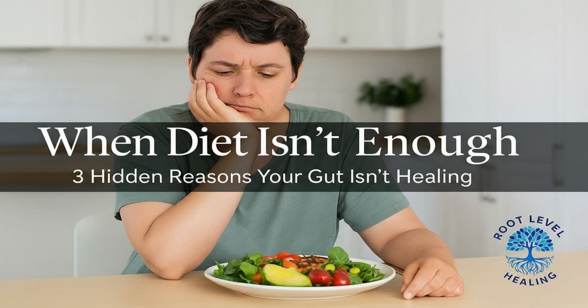 A person looking frustrated at a plate of healthy food, representing the reasons a gut isn't healing.
